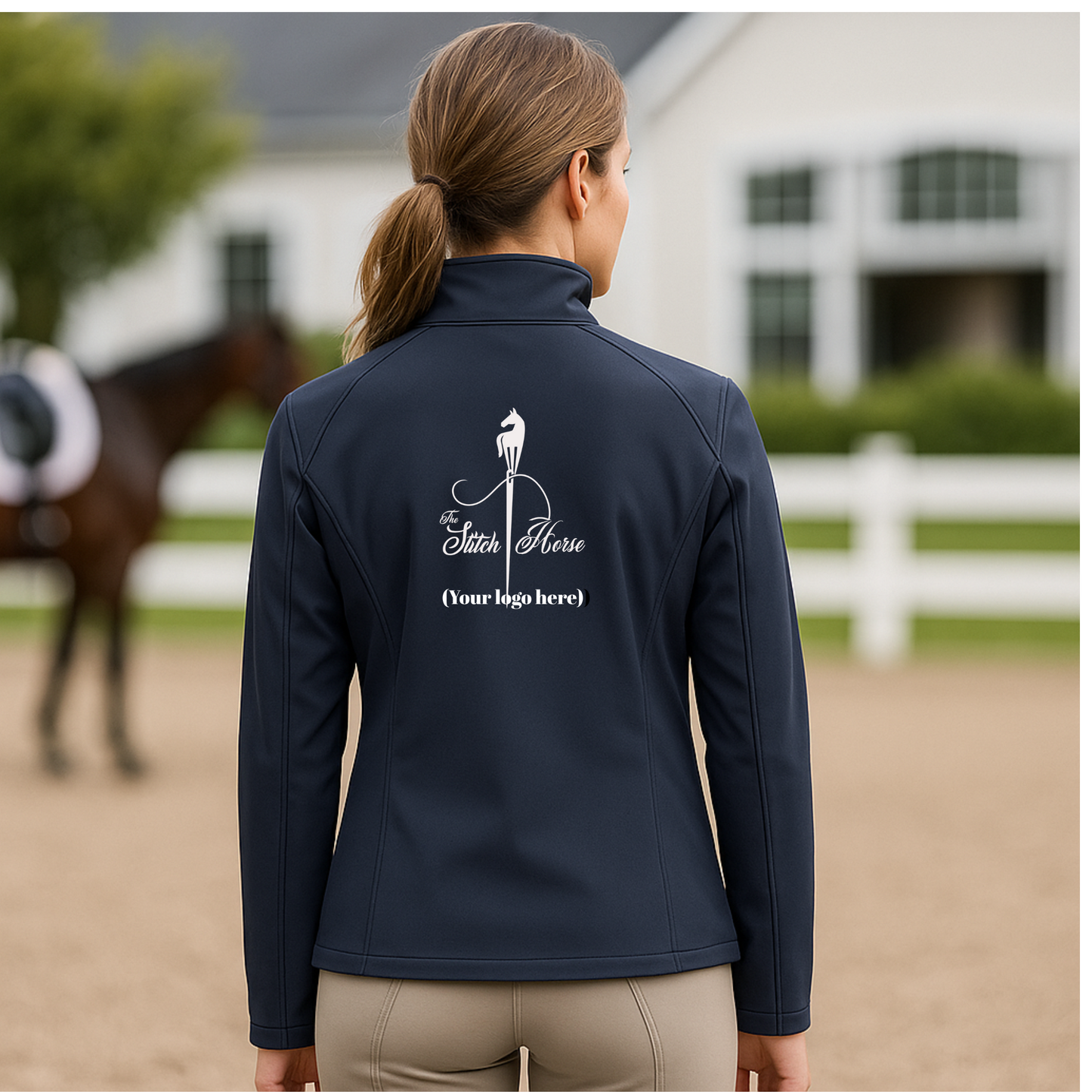 Person wearing a navy blue jacket with a horse logo in an equestrian setting