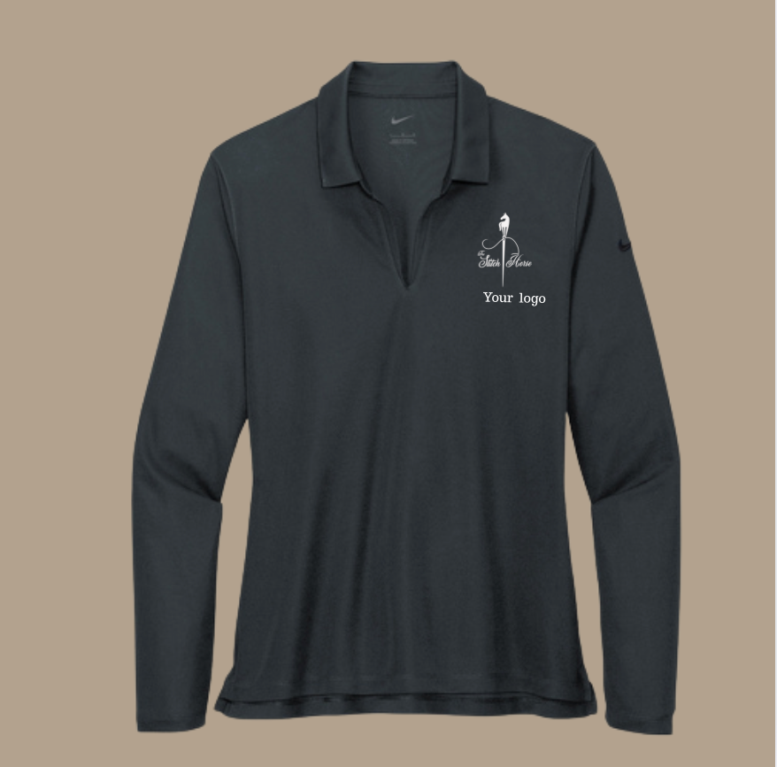 Black long-sleeve shirt with a logo on a beige background