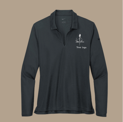 Black long-sleeve shirt with a logo on a beige background